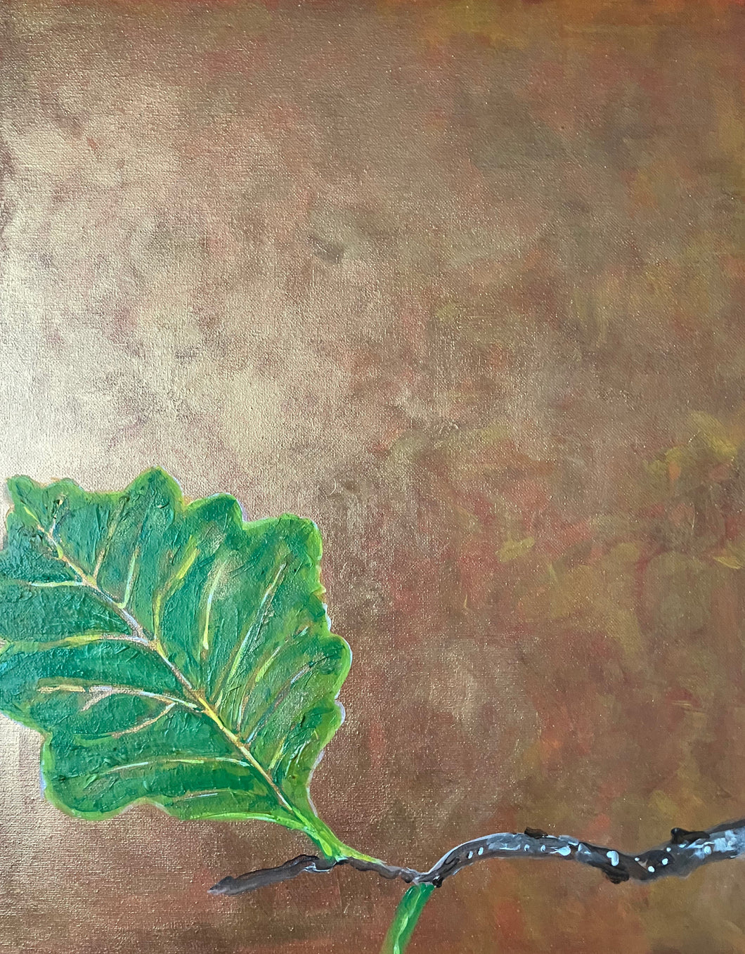 Painting of a green leaf on a textured gold background