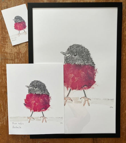 Framed artwork of a bird with a red breast